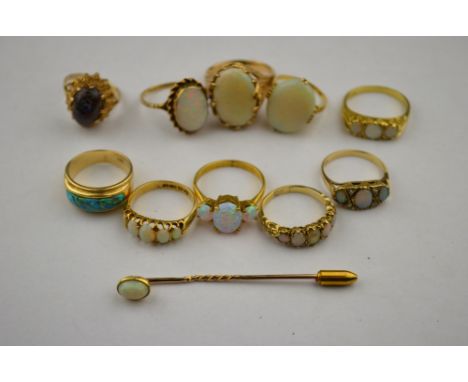 Two 18ct set opal rings to/w eight other opal rings, some set 9ct, some gilt metal to/w opal stick pin Three stone opal ring 