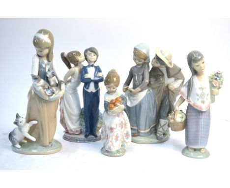Five Lladro figures including a girl with cat and kittens, girl holding a basket of oranges (5)   Condition Report  All good 