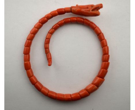 A Georgian articulated coral serpent bangle   Condition Report  Fork-tongue broken, approx 35g all in
