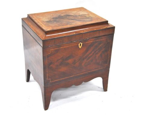 A Regency feather-banded mahogany cellarette, the hinged caddy top enclosing a vacant interior, raised on shaped bracket feet