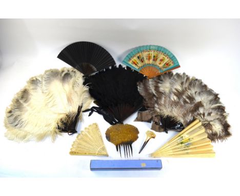 Three ostrich feather fans on tortoiseshell effect frames, a brise cut bone fan with twenty-six ribs and figural carved guard