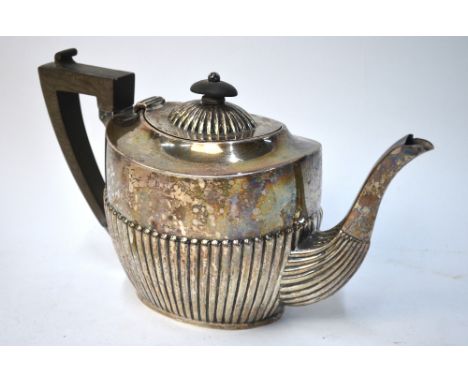 An Edwardian silver oval half-reeded teapot, maker's mark rubbed, Birmingham 1904, 16.8 oz gross
