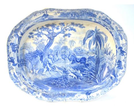 An early 19th century Spode blue and white transfer meat plate with gravy well, decorated with 'Shooting a Leopard' pattern, 