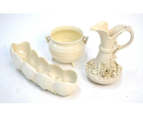 Belleek porcelain - a first period Shell shaped flower trough, 22 cm long to/w a second period jug decorated in relief with f