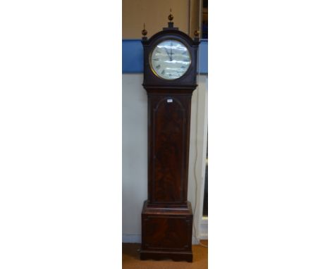 An early 19th century mahogany longcase clock with eight-day strike/silent movement and circular enamel dial, arched hood wit