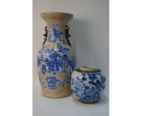 A Chinese underglaze blue decorated vase designed with a Scholar and his attendants beside sacred symbols and Scholar's imple