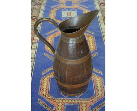 A coopered copper and oak large beer-jug (used as stick-stand), 72 cm high