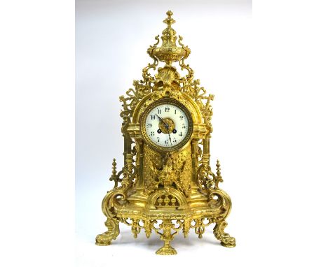 A large and ornate cast brass mantle clock with eight-day Japy Freres movement