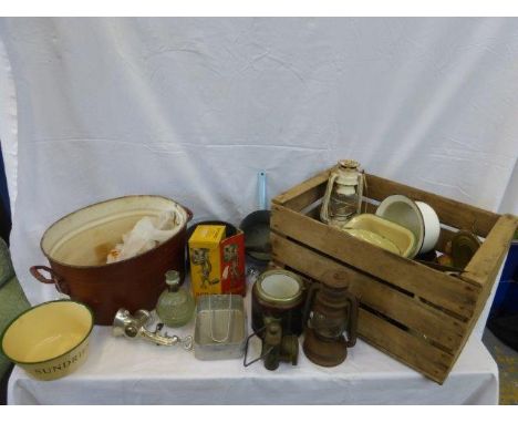 An assortment of enamel kitchenalia, oil lanterns etc. 