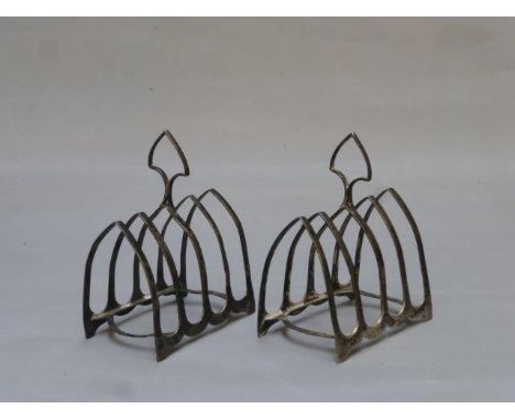 A pair of silver four-slice toastracks, maker W. Hutton & Sons Ltd., Sheffield 1912.