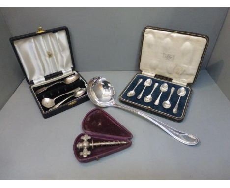 An assortment of silver plated flatware including some silver and a large Roberts & Belk ladle.