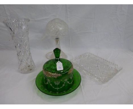An assortment of glassware including a cut glass mushroom shaped table lamp, a Victorian green glass and enamelled cheese dom