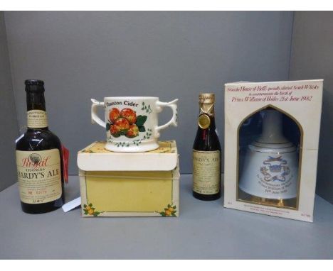 A boxed Bells Scotch Whisky decanter with contents, two bottles of Thomas Hardy's Ale and a Wade Taunton Cider twin handled m