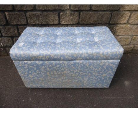 A padded storage trunk on castors. 