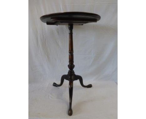 A 19th Century mahogany dish topped tripod occasional table raised on a turned column. 