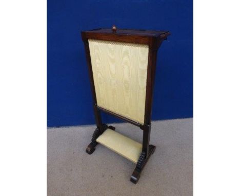 Manner of Gillows, a rosewood and yellow silk firescreen with shelf. 