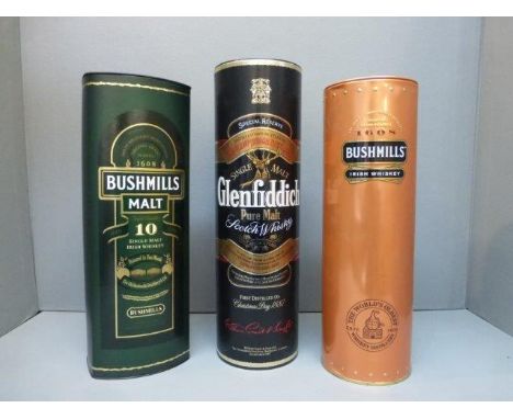 Two cased bottles of Bushmills Irish Whiskey and a bottle of Glenfiddich Pure Malt Scotch Whisky.