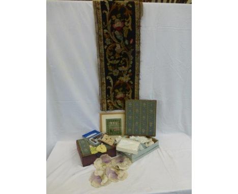 A box of assorted needlework and tapestry. 