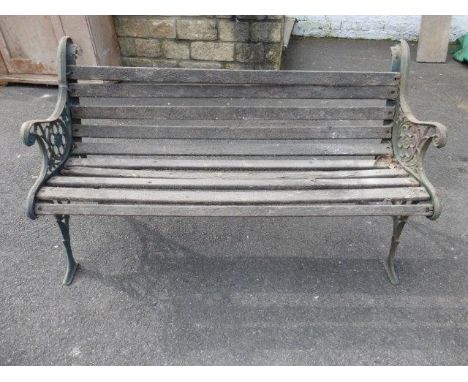 A wooden slatted garden bench. 