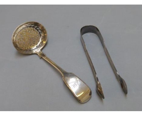 A silver sugar sifter ladle, maker WRS, Exeter 1837 and a pair of silver tongs, maker Hester Bateman, London 1835. 