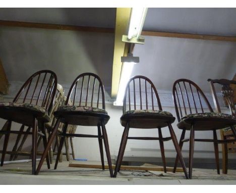 A set of four Ercol high spindle back dining chairs. 