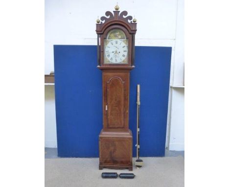 An early 19th Century eight day longcase clock with arched painted dial bearing the name Wooler & Co. Norwich, set within an 