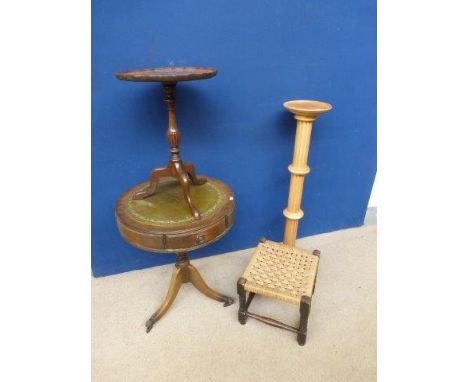 A reproduction drum table, a tripod occasional table, a torchere and a rattan footstool. 