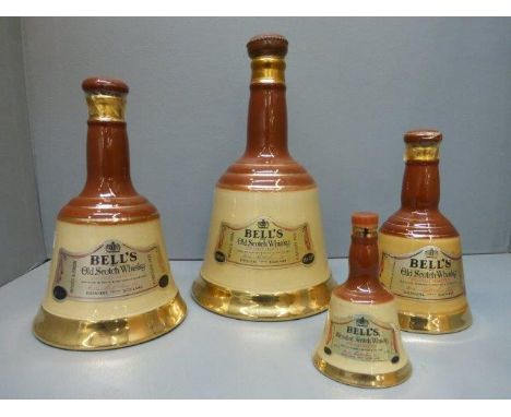 Four graduating Bells Scotch Whisky decanters, with contents. 