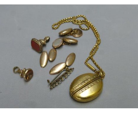 An assortment of watch fobs, cufflinks and a pendant necklace. 