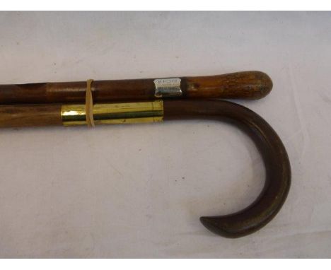 Two walking canes, one with a silver plaque inscribed R. Bench presented by Arthur Shrewsbury Sept. 9th 1887.