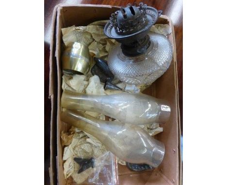 A Victorian cut glass oil lamp reservoir and two glass funnels. 