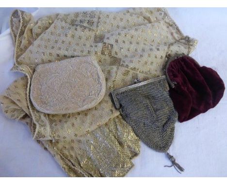 A chainmail purse, a red velvet purse, an Art Deco deaded purse with mirror and zip enclosure and a lace and metal embellishe