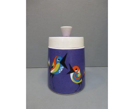 A rare Goebel tapering lidded pot decorated with brightly coloured birds against a purple background, stamped 1963.