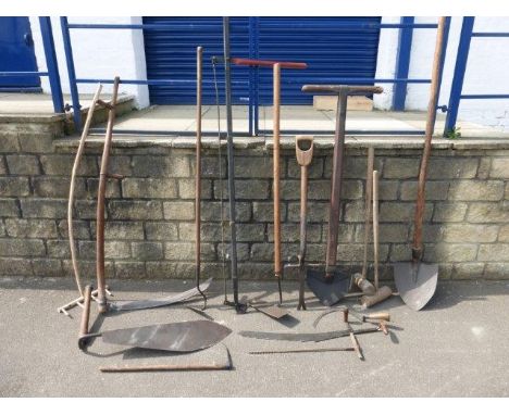 A collection of early wooden handled farm worker's/gardener's hand tools including a scythe.