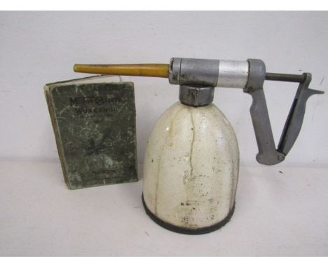 Original Shell cream oil can and vintage motorcyclists workshop book