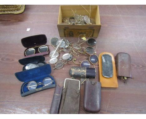 A box of vintage spectacles
