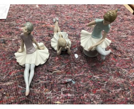 Two Lladro figurines of ballerinas; together with one Nao figure