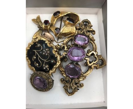A quantity of victorian mourning brooches to inc. amethyst & garnet set examples
