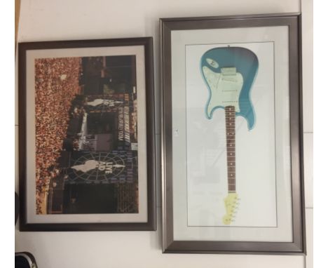 A decorative colour print of an electric guitar; together with a Live Aid Wembley stadium photo (2)