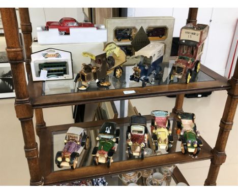 A quantity of ceramic cars and buses; together with other boxed diecast vehicles (A/F)