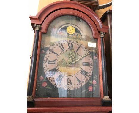 A vintage moonphase weight-driven wall clock