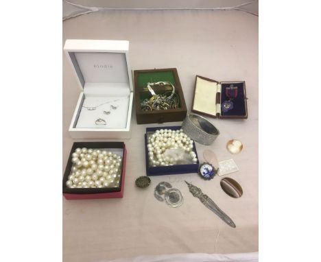 A quantity of silver jewellery: an Odd Fellows medal, 1960s Chester silver bangle, necklaces and a ring and earring set