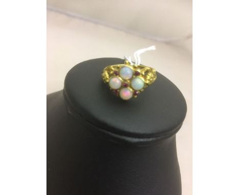 A 9ct opal and ruby dress ring