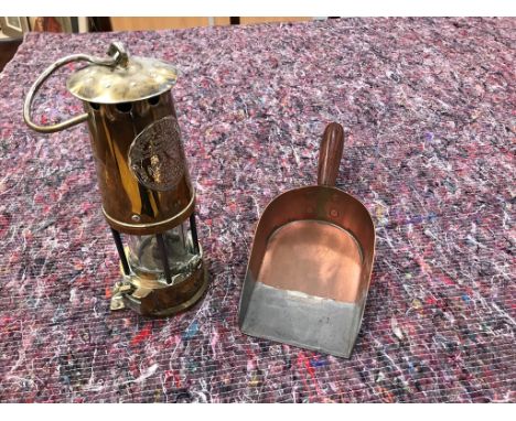 A brass miner's lamp; together with a copper shovel