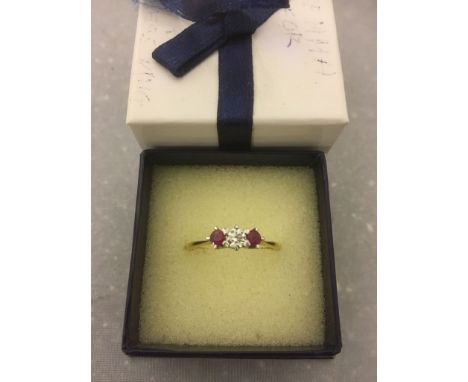 An 18ct and platinum, diamond and ruby dress ring