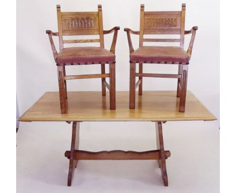 A light oak Arts & Crafts style refectory  dining table and four carver chairs by Webber of Croydon, the table 5ft x 2ft 4"