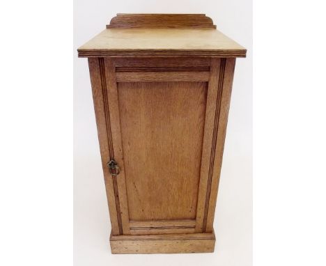 An Edwardian light oak Jas Shoolbred bedside cupboard
