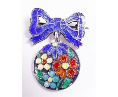 A silver and enamel flower and bow brooch