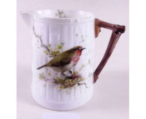 A Royal Worcester jug painted robin - signed W M Powell, 6cm tall, date code 1904, restored to spout