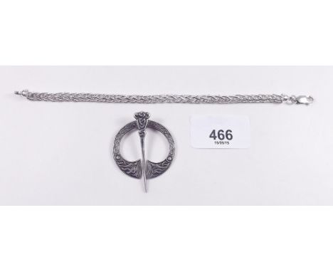 A silver bracelet, boxed and a silver celtic brooch 